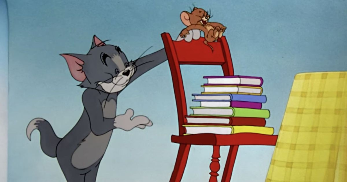 Playful Cat And Mouse Tom And Jerry Wallpaper