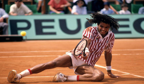 yannick noah tennis clay court sliding action shot
